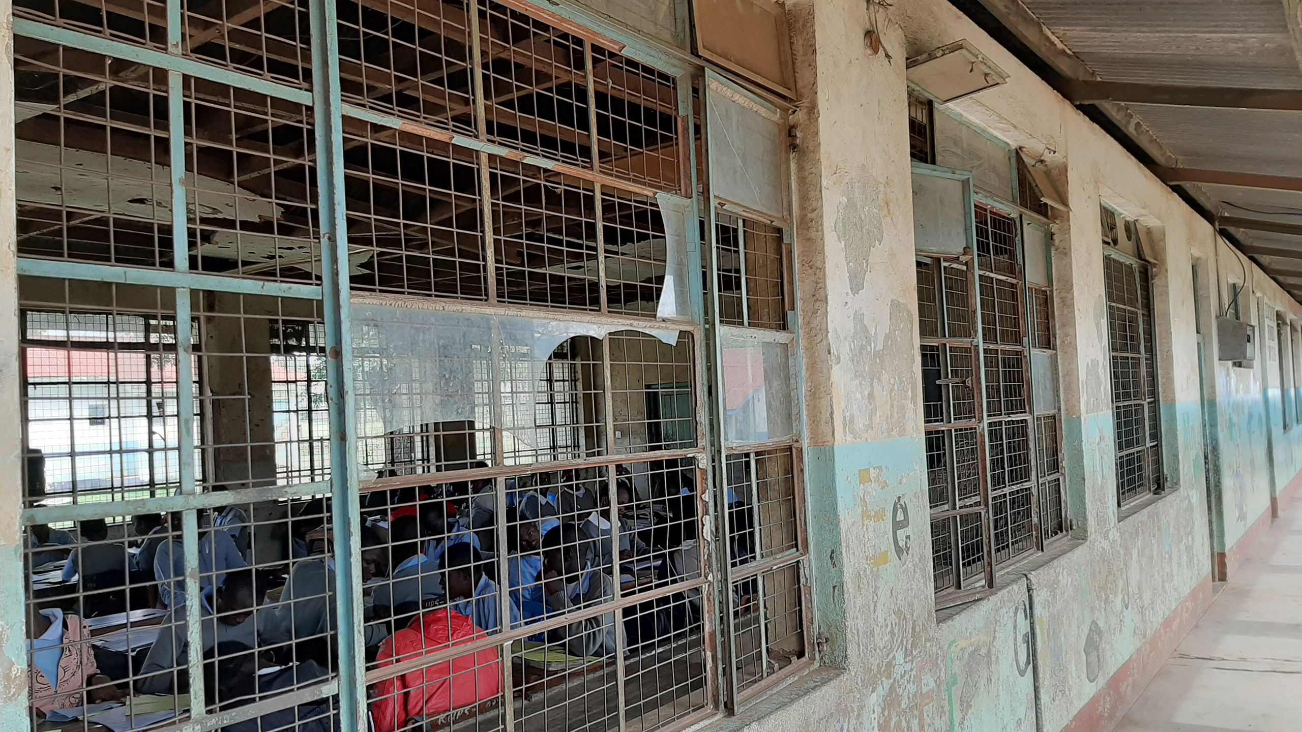 Broken glass windows and a corridor.